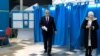 Kazakhstan's President Kassym-Jomart Tokayev walks out of a voting booth before casting his ballot at a polling station during presidential elections in Astana, Kazakhstan, November 20, 2022