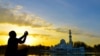 Generic -- Stock Photo: muslim kid prayed during sunset Image ID:261167027 Copyright: badins