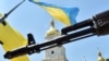 UKRAINE – Gun-mashine of a recruit of the Ukrainian volunteer battalion of Azov while he's taking the oath in the center of Kyiv prior to leaving for the east of the country to take part in ATO. Kyiv, July 16, 2014