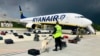 BELARUS- A Belarusian dog handler checks luggages off a Ryanair Boeing 737-8AS (flight number FR4978) parked on Minsk International Airport's apron in Minsk, on 23May2021.